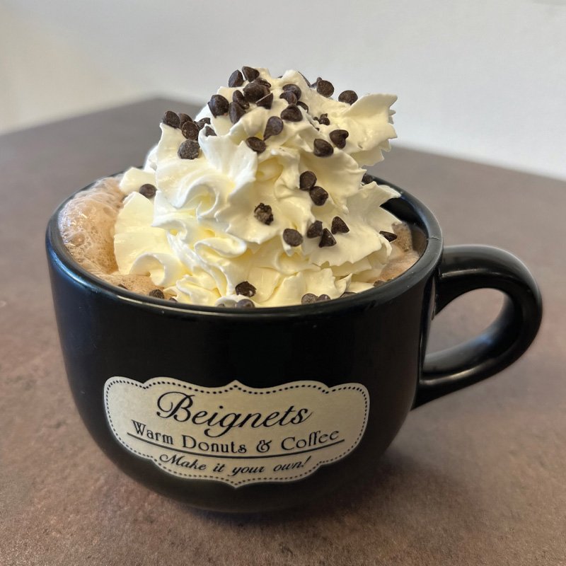 Hot Chocolate topped with Whipped Cream and Chocolate Chips from Beignets in Denville, NJ - denvilleguide.com
